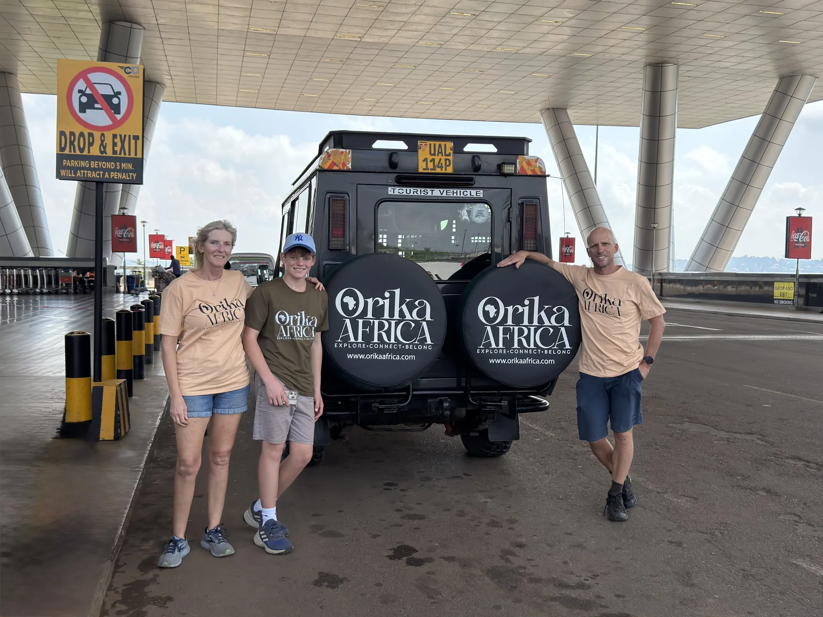 Guests with an Orika Africa branded safari Land Cruiser in Uganda